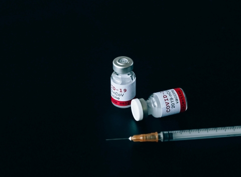 Image of a syringe and medication.