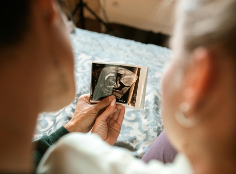 Parents Holding MRI scan of their baby